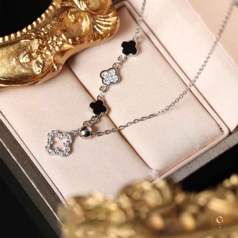 Luxe Silver Four Leaf Clover Necklace: Layer Them for a Unique, Premium Look.
